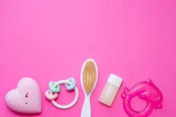 Flat lay composition with baby accessories and space for text on pink background. spa consept
