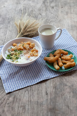 Breakfase meal. Congee or Rice porridge minced pork, boiled egg with soy milk and Chinese deep fried double dough stick