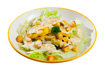 Caesar salad on plate at restaurant