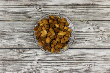 Rusks cubes on a glass plate, top view.