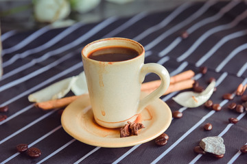 Fototapeta na wymiar Espresso cup on the background of coffee machines, black coffee morning on coffee maker