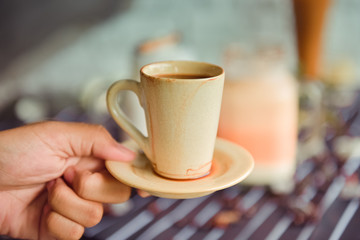 Espresso cup on the background of coffee machines, black coffee morning on coffee maker