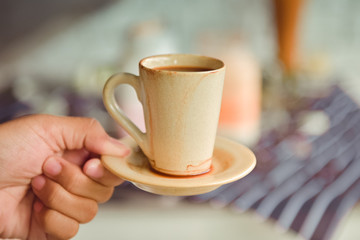 Espresso cup on the background of coffee machines, black coffee morning on coffee maker