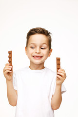 little beautiful boy holding chocolates studio shot 