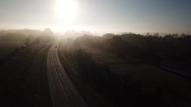 Aerial shot rising through thick fog in the Missouri Ozarks