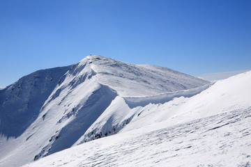 Fototapeta na wymiar Mountain ridge in winter
