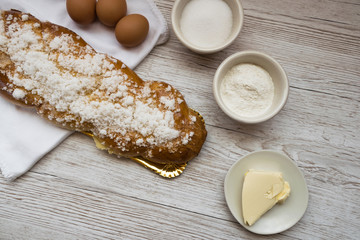 Braided bread, typical Easter dessert with the ingredients to make it