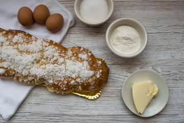 Braided bread, typical Easter dessert with the ingredients to make it