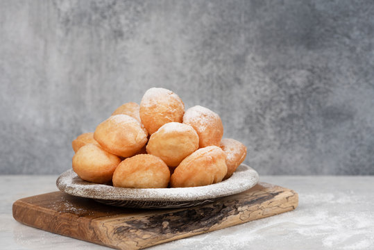 Baursak - traditional Kazakh (Asia) food \ national bread in plate on marble  background