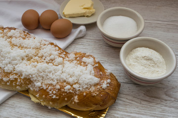 Braided bread, typical Easter dessert with the ingredients to make it