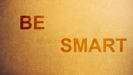 Paper cardboard texture with be smart words like weted with water background