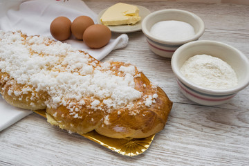 Braided bread, typical Easter dessert with the ingredients to make it
