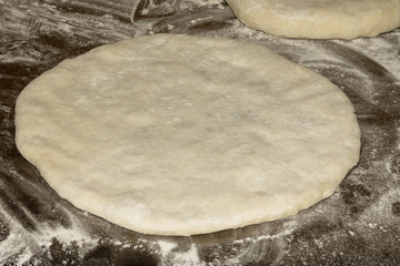 Traditional Caucasian cuisine. Ossetian pies. Preparing dough. Filling from leaves of beet and Ossetian cheese. Close up. Selective focus.