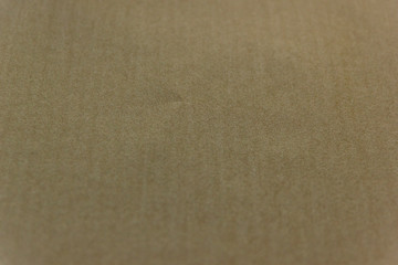 Beautiful light brown paper background. Empty space concept. Light brown paper texture background. Colored cardboard fibers and grain.