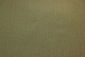 Beautiful light brown paper background. Empty space concept. Light brown paper texture background. Colored cardboard fibers and grain.