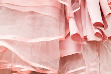 Wedding dress detail. Pink wedding dress frills close up.