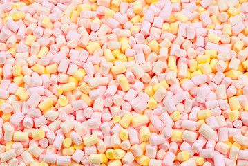 Marshmallow. Background of pink and yellow colorful mini marshmallows.
