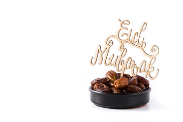 Dates and Eid Mubarak message isolated on white background. Copyspace