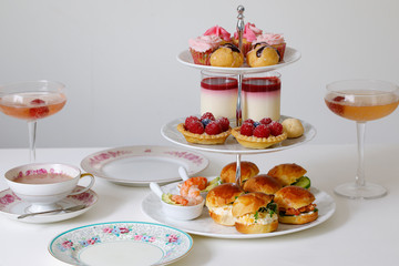 Afternoon tea with mini brioche canapes and selection of sweets