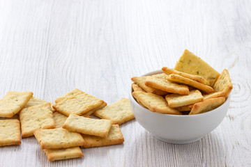 Dry salty cracker cookies in bowl on the table