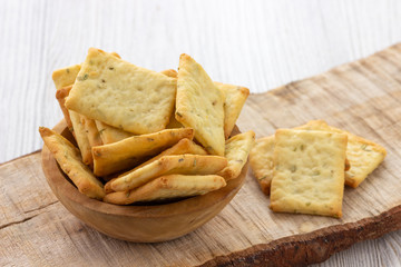 Dry salty cracker cookies in bowl on the table