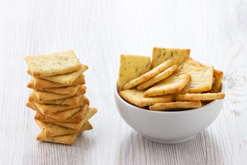 Dry salty cracker cookies in bowl on the table