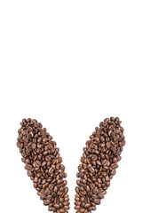 Easter holiday background with bunny ears made of freshly roasted coffee beans on a white background. Creative easter concept. Copy space.