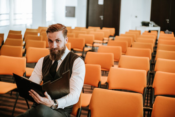 Bearded businessman in conference room