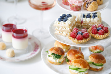 Afternoon tea with mini brioche canapes and selection of sweets