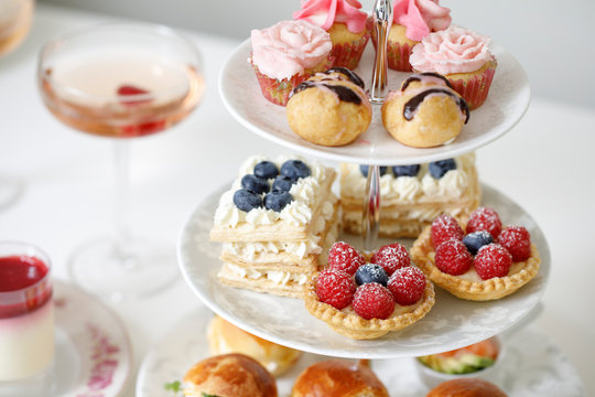 Afternoon tea with mini brioche canapes and selection of sweets