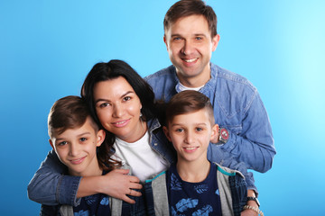 Portrait of happy family with twins look in camera and smiling