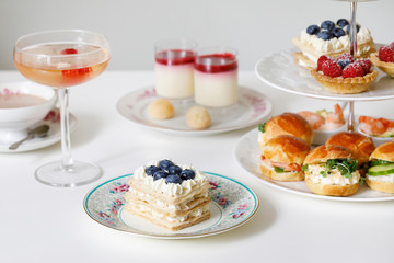 Afternoon tea with mini brioche canapes and selection of sweets