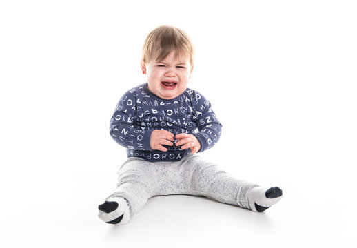 A One Year Old Boy On Studio White Background