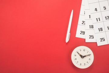 Calendar with dates, clock and pen 
