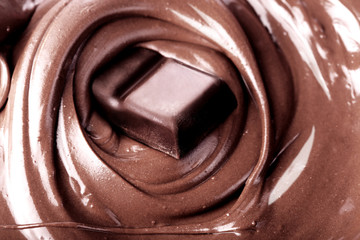 Background with melts black chocolate bar