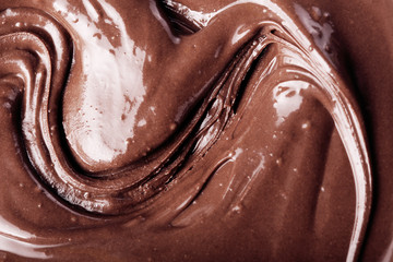 Background with melts black chocolate bar