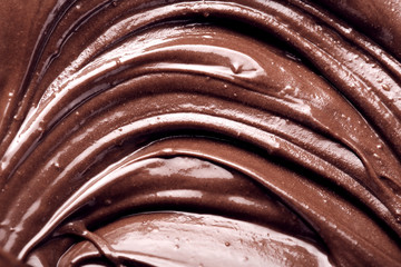 Background with melts black chocolate bar