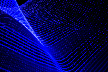 Abstract figure of bluish lights on black background.