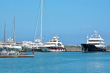 Fototapeta premium Yachts anchored in Port Pierre Canto at the Boulevard de la Croisette in Cannes, France.