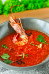 Gazpacho soup with shrimps prawns (red seafood soup) serving. food background. copy space