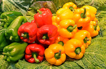 Ripe yellow, red and green sweet bell Peppers for sale on Vegetables Market