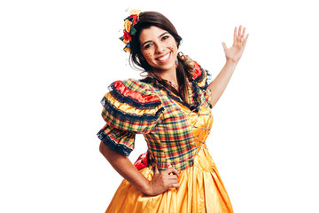 Brazilian woman wearing typical clothes for the Festa Junina dancing isolated on white background