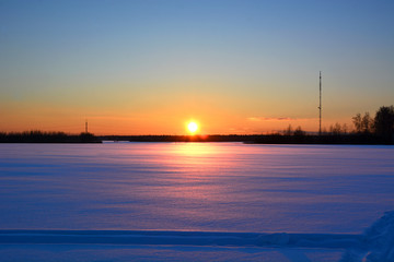 Naklejka na ściany i meble winter sunset over the field