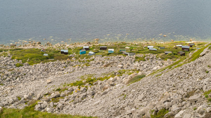 View from the South West Coast Path  towards the fishing boats at the shore of the sea at Fortuneswell Hill, Isle of Portland, Jurassic Coast, Dorset, UK