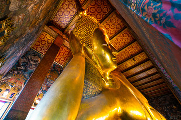 Reclining golden buddha inside of pagoda Wat Pho