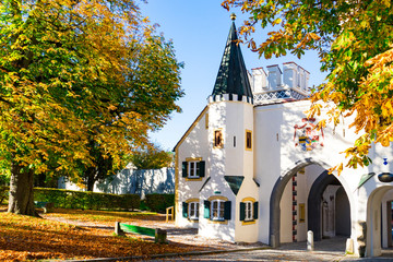 Bavarian gate and trees in autumn colors,  Landsberg am Lech, Germany_