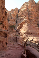 Stairs leading through a valley in the desert city of Petra, Jordan