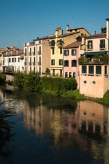 Fototapeta na wymiar colorful houses along canal in Padova, 6