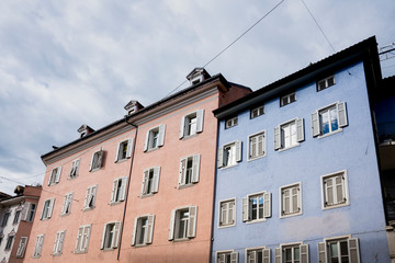 Fototapeta na wymiar blue and pink apartments in Bolzano, Italy