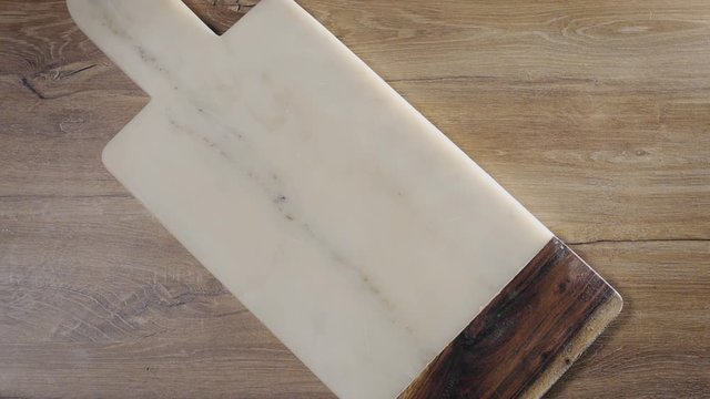 Potatoes fall in slow motion to the rock board on the table, falling vegetables, food in super slow motion, table top240fps Full HD